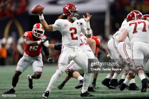 Jalen Hurts of the Alabama Crimson Tide throws a pass during the second quarter against the Alabama Crimson Tide in the CFP National Championship...