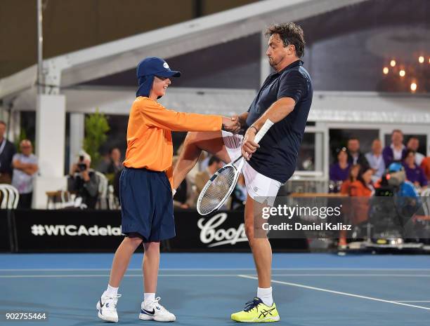 Henri Leconte of France reacts to a ball boy in his match with Mats Wilander of Sweden against Mark Philippoussis of Australia and Mansour Bahrami of...