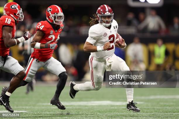 Jalen Hurts of the Alabama Crimson Tide runs the ball during the second quarter against the Georgia Bulldogs in the CFP National Championship...