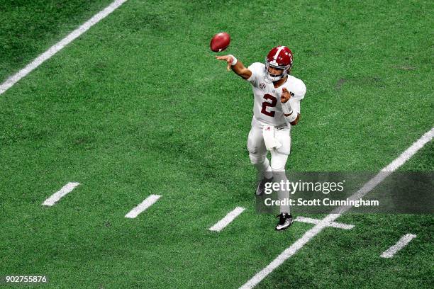 Jalen Hurts of the Alabama Crimson Tide throws a pass during the second quarter against the Georgia Bulldogs in the CFP National Championship...