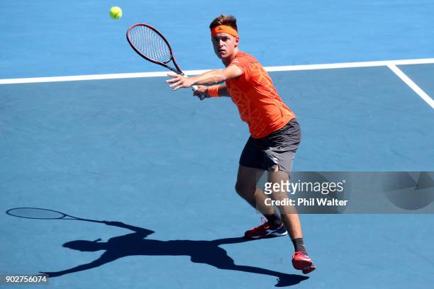 Liam Caruana of Italy plays a forehand during his first round match against Steve Johnson of the USA during day two of the ASB Men's Classic at ASB...