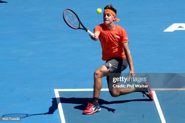 Liam Caruana of Italy plays a forehand during his first round match against Steve Johnson of the USA during day two of the ASB Men's Classic at ASB...