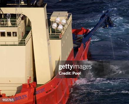 U.S. Navy Aviation Specialist Mate Joey Jupin looks out towards the crash site of EgyptAir Flight 990 U.S. Navy Aviation Specialist Mate Joey Jupin looks out towards the crash site of EgyptAir Flight 990