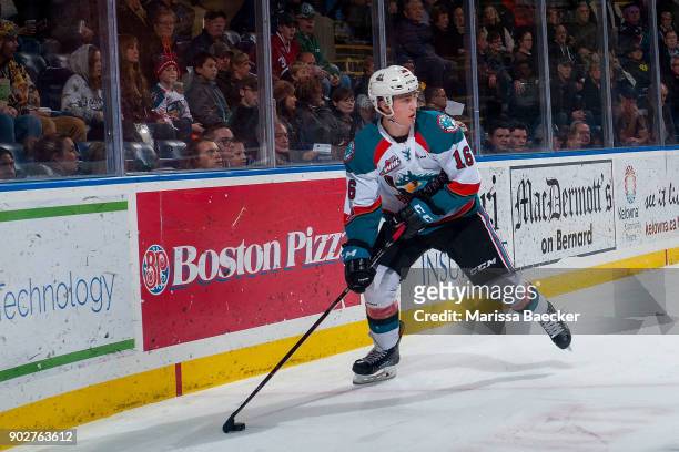 Kole Lind of the Kelowna Rockets skates with the puck at the boards against the Tri-City Americans at Prospera Place on January 3, 2017 in Kelowna,...