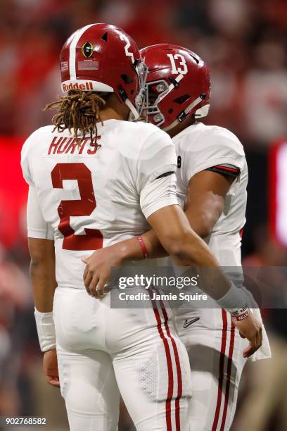 Tua Tagovailoa celebrates a touchdown pass with Jalen Hurts of the Alabama Crimson Tide during the third quarter against the Georgia Bulldogs in the...