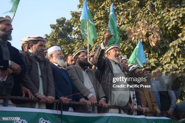 Pakistani activists from Waziristan, Orakzai, Mehmand agency, Khurram agency shout slogans and hold flags during a protest in Lahore on January 08,...