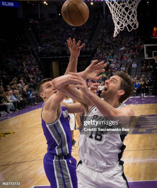 Sacramento Kings guard Bogdan Bogdanovic strips the ball from the San Antonio Spurs center Pau Gasol on Monday, Jan. 8, 2018 at the Golden 1 Center...