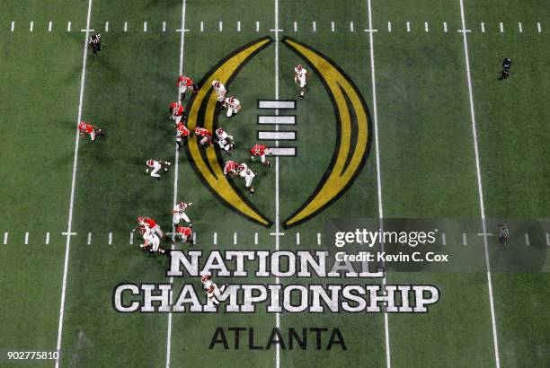 Najee Harris of the Alabama Crimson Tide runs the ball during the second half against the Georgia Bulldogs in the CFP National Championship presented...