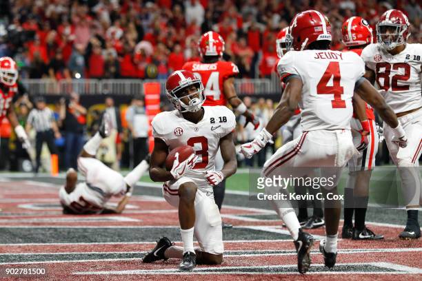 Calvin Ridley of the Alabama Crimson Tide celebrates a seven yard touchdown catch during the fourth quarter against the Georgia Bulldogs in the CFP...