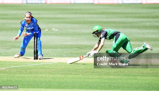 Alex Price of the Adelaide Strikers runs out Erin Osborne of the Melbourne Stars during the Women's Big Bash League match between the Adelaide...