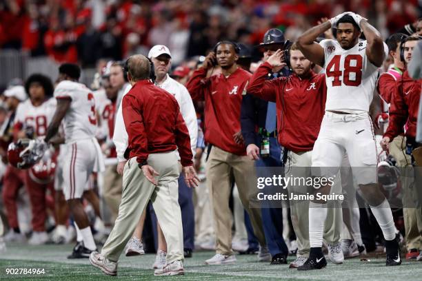 Head coach Nick Saban of the Alabama Crimson Tide and his team react to a missed field goal at the end of regulation against the Georgia Bulldogs in...