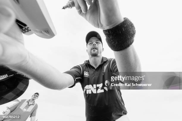 Colin Munro of New Zealand signs autographs during the second match in the One Day International series between New Zealand and Pakistan at Saxton...