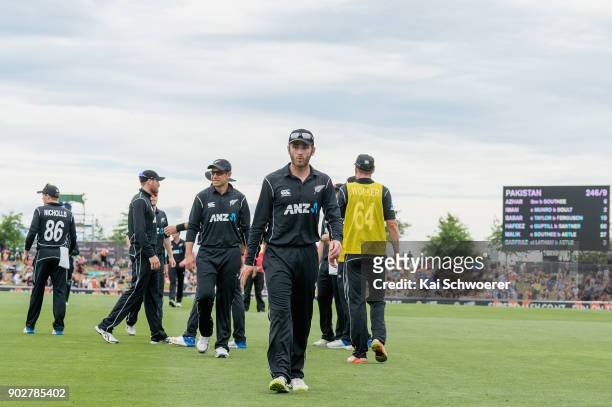Captain Kane Williamson of New Zealand and his team mates walk from the ground at the lunch break during the second match in the One Day...