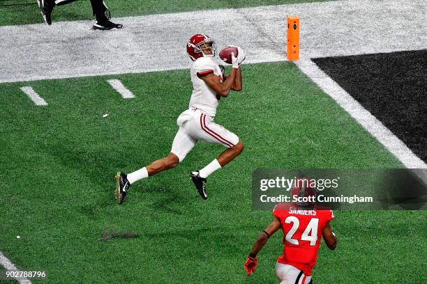 DeVonta Smith of the Alabama Crimson Tide catches a 41 yard touchdown pass to beat the Georgia Bulldogs in the CFP National Championship presented by...