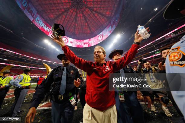 Head coach Nick Saban of the Alabama Crimson Tide celebrates beating the Georgia Bulldogs in overtime to win the CFP National Championship presented...