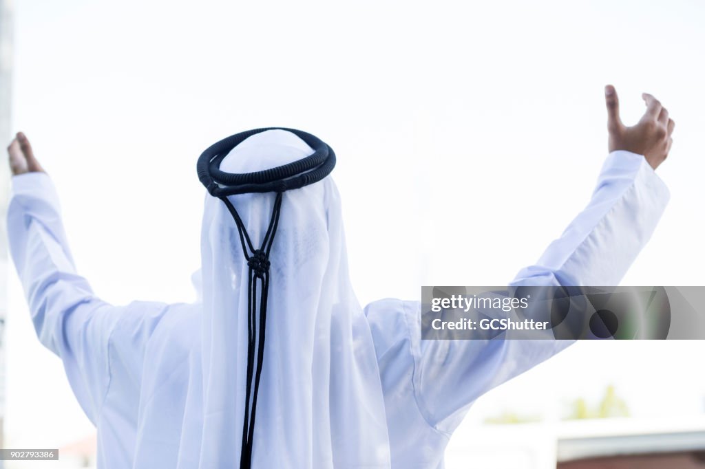 Young Arab opening arms and greeting welcome