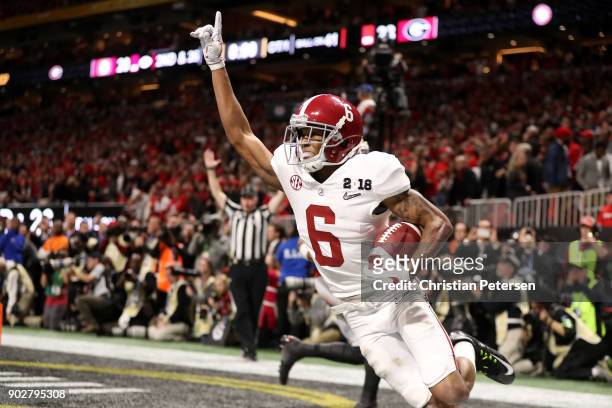 DeVonta Smith of the Alabama Crimson Tide celebrates catching a 41 yard touchdown pass to beat the Georgia Bulldogs in the CFP National Championship...