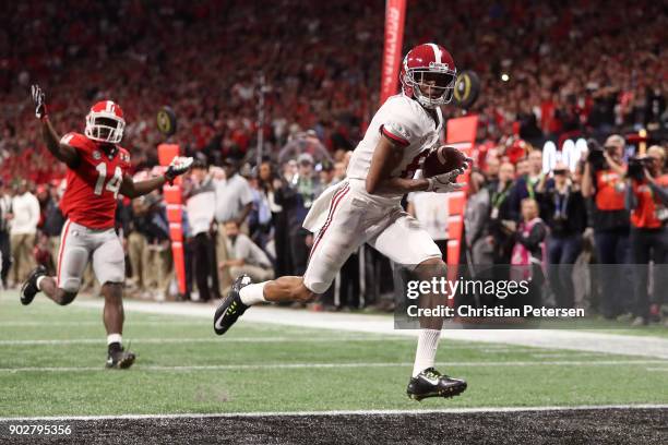 DeVonta Smith of the Alabama Crimson Tide catches a 41 yard touchdown pass to beat the Georgia Bulldogs in the CFP National Championship presented by...