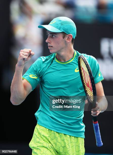 Alex De Minaur of Australia celebrates winning match point in his 1st round match against Fernando Verdasco of Spain during day three of the 2018...