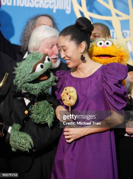 Sandra Oh and the cast of Sesame Street, winners of the Emmy for Lifetime Achievement Award, pose in the press room at the 36th Annual Daytime Emmy...