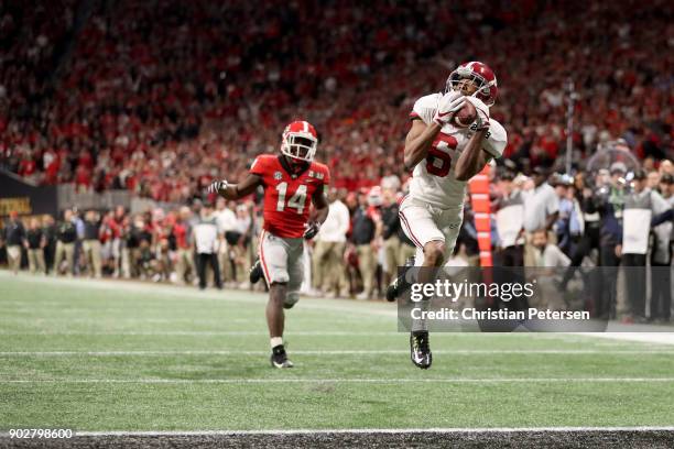 DeVonta Smith of the Alabama Crimson Tide catches a 41 yard touchdown pass to beat the Georgia Bulldogs in the CFP National Championship presented by...