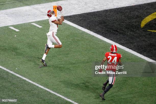 DeVonta Smith of the Alabama Crimson Tide catches a 41 yard touchdown pass to beat the Georgia Bulldogs in the CFP National Championship presented by...