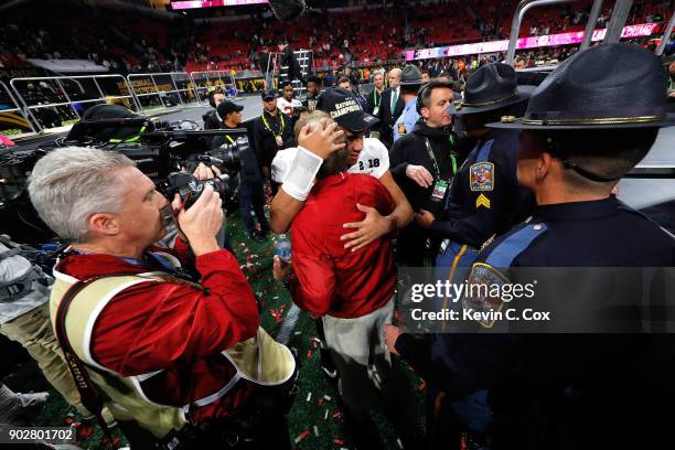 Head coach Nick Saban of the Alabama Crimson Tide celebrates with Tua Tagovailoa of the Alabama Crimson Tide after beating the Georgia Bulldogs in...