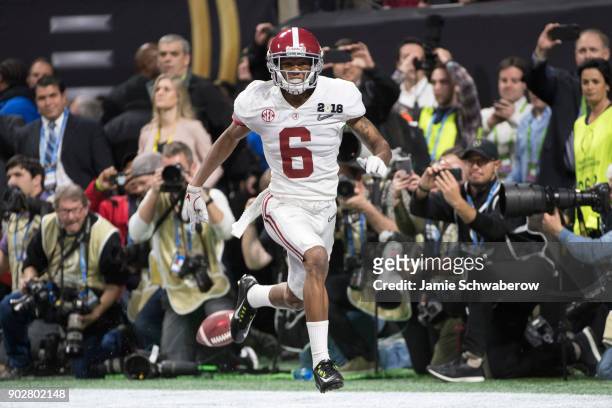 DeVonta Smith of the Alabama Crimson Tide celebrates after catching the winning touchdown against the Georgia Bulldogs during the College Football...