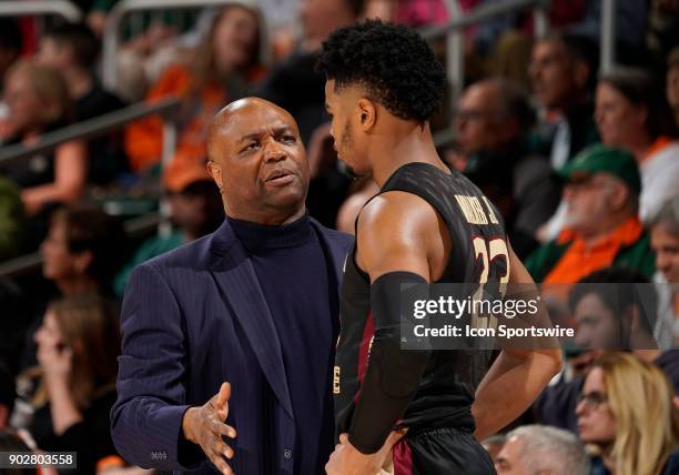 Florida State Head Coach Leonard Hamilton speaks to a player during a college basketball game between the Florida State University Seminoles and the...