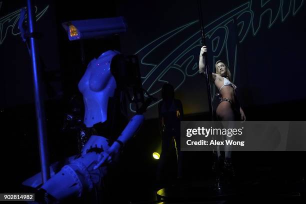 Stripper robot' performs alongside with a pole dancer during a debut of the first robotic erotic dancers in the world at Sapphire Las Vegas...