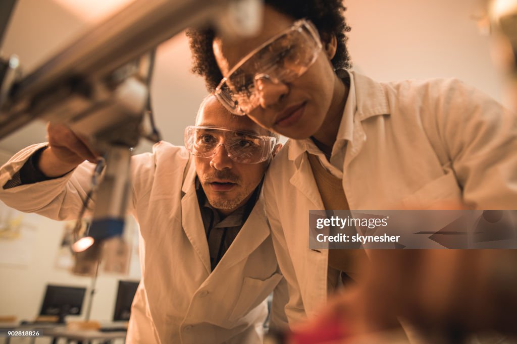 Below View Of Experienced Engineers Cooperating While Working On ...