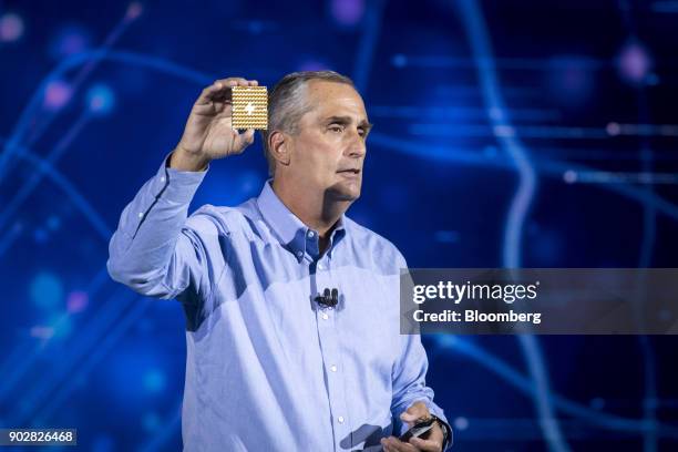 Brian Krzanich, chief executive officer of Intel Corp., holds up a 49-qubit superconducting quantum test chip named 'Tangle Lake' while speaking...