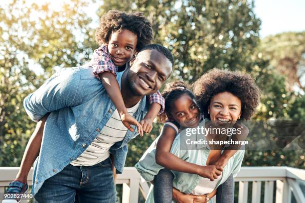 what a nice day out carrying the children - african ethnicity family africa stock pictures, royalty-free photos & images