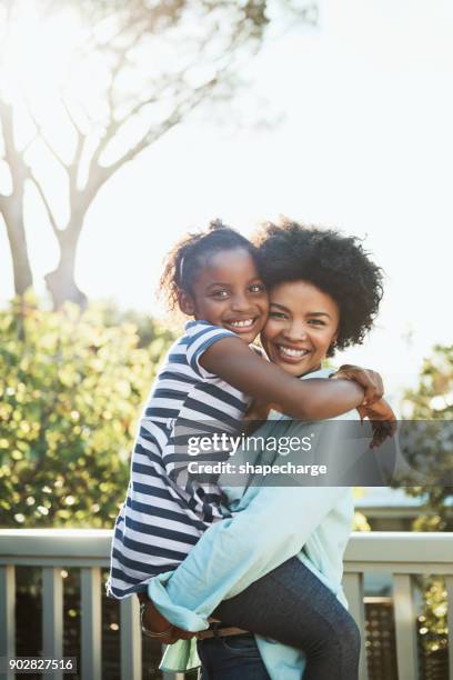 she is still small enough to carry - family hugging bright stock pictures, royalty-free photos & images