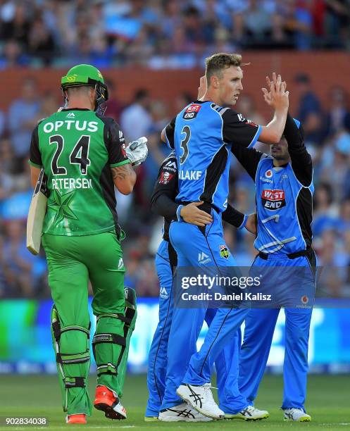 Billy Stanlake of the Adelaide Strikers celebrates with his team mates after bowling out Kevin Pietersen of the Melbourne Stars during the Big Bash...