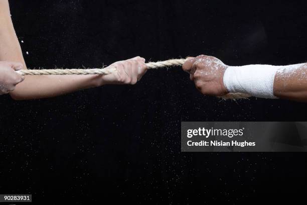 fitness - male athlete with rope on black background stock pictures, royalty-free photos & images