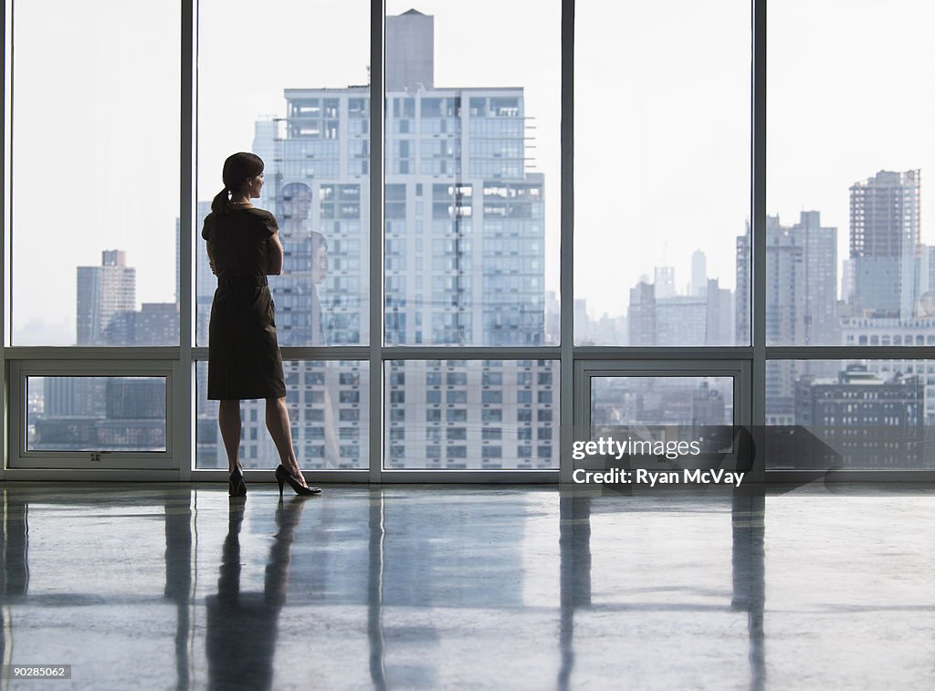 Business woman looking out window