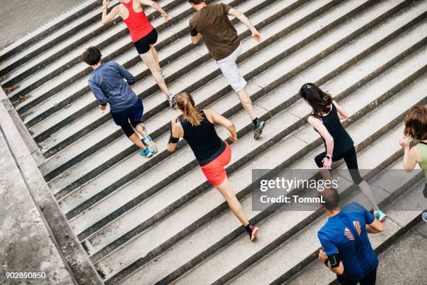 group of amateur athletes training together in the city - challenge stock pictures, royalty-free photos & images