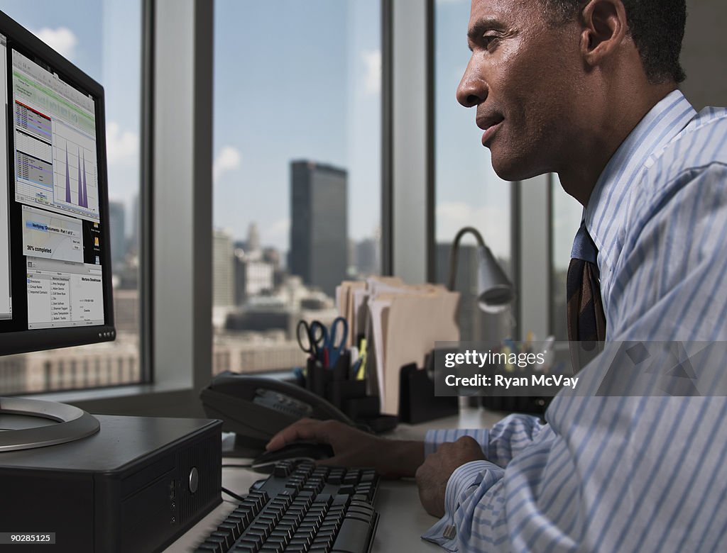 Business man working on desktop computer