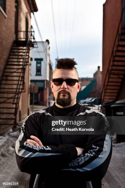 man with mohawk facing camera looking tough. - bouncer stock pictures, royalty-free photos & images