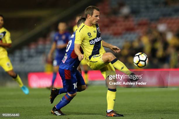 Wout Brama of the Mariners contests the ball against Wayne Brown of the Jets during the round 15 A-League match between the Newcastle Jets and the...