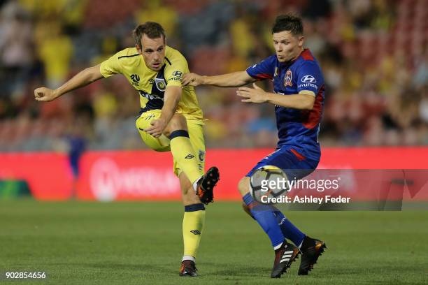 Wout Brama of the Mariners contests the ball against Wayne Brown of the Jets during the round 15 A-League match between the Newcastle Jets and the...