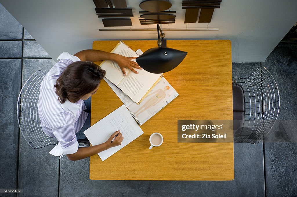 Overhead view of girl doing homework