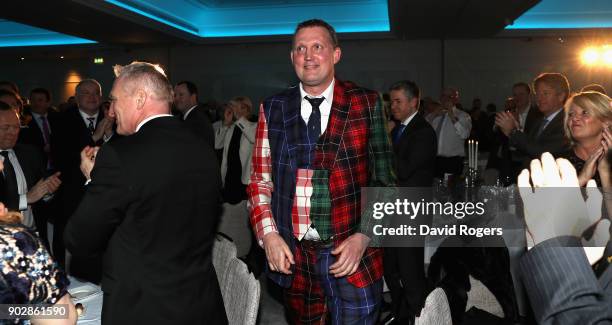 Doddie Weir, the former Scotland international and Newcastle Falcons player, walks onto the stage during the Rugby Union Writers' Club Annual Dinner...