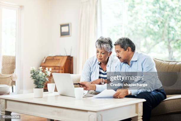 planning our retirement together - senior home finances stock pictures, royalty-free photos & images