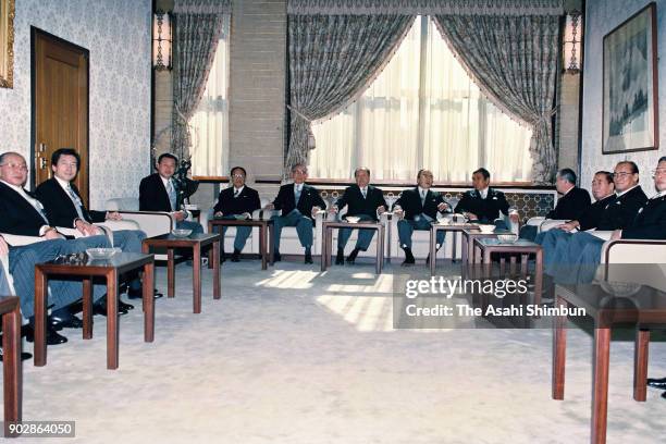 Prime Minister Kiichi Miyazawa and his cabinet members attend their first cabinet meeting at the prime minister's official residence on December 12,...