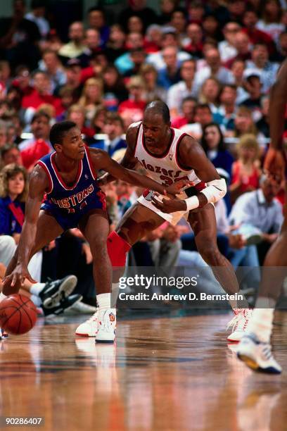 Terry Porter of the Portland Trail Blazers plays defense against Isiah Thomas of the Detroit Pistons during a game played in 1990 at The Memorial...