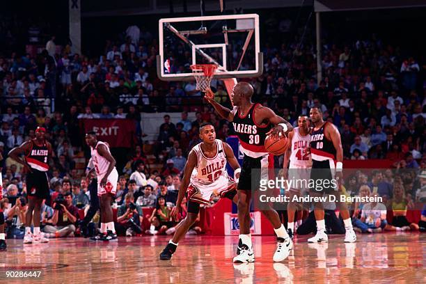 Terry Porter of the Portland Trail Blazers looks to make a play against B.J. Armstrong of the Chicago Bulls during a game in 1991 at the Boston...