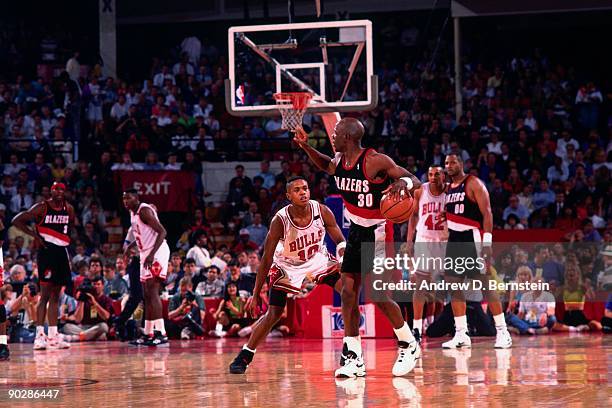 Terry Porter of the Portland Trail Blazers looks to make a play against B.J. Armstrong of the Chicago Bulls during a game in 1991 at the Boston...