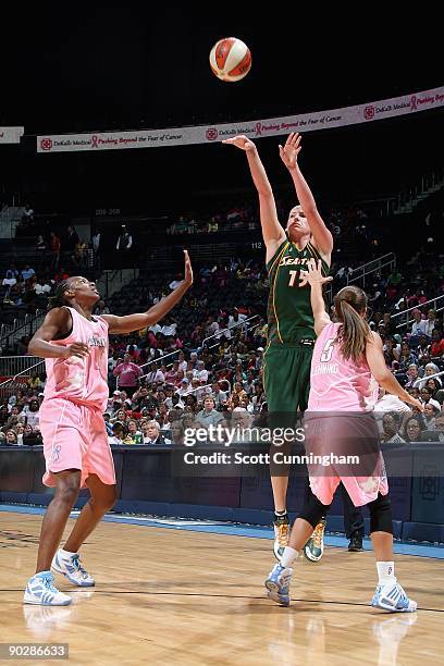 Lauren Jackson of the Seattle Storm shoots over Sancho Lyttle and Shalee Lehning of the Atlanta Dream during the WNBA game on August 15, 2009 at...